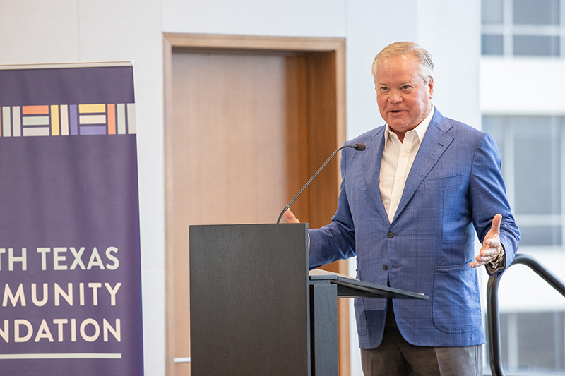 John Goff speaking at a podium.