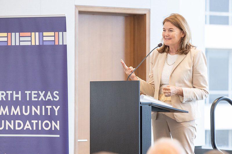 Rose Bradshaw speaking at a podium.